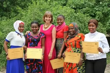 English course graduates with their teacher